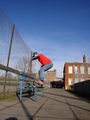 Skateboarder grinding public bench 2005.jpg